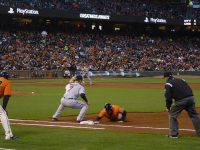 Hunter Pence dives back to the bag in time